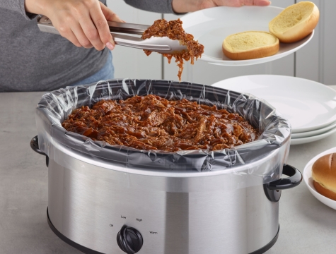 Slow cooker with a liner and BBQ pulled pork inside