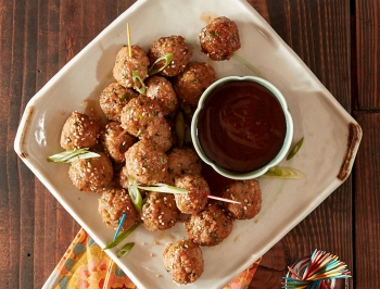 Teriyaki meatballs sitting on a plate 