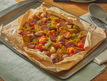 breakfast hash in an open parchment cooking bag at a set table