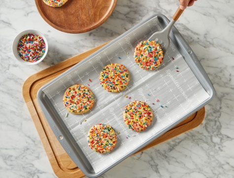 cookies with sprinkles on a baking sheet